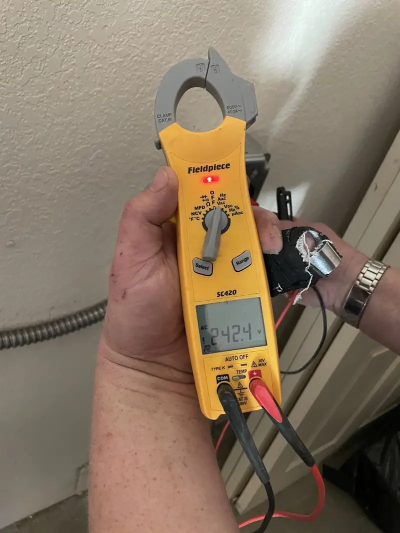 Voltage testing with clamp meter during Hot Tub / Pool Electrical Wiring in Athens